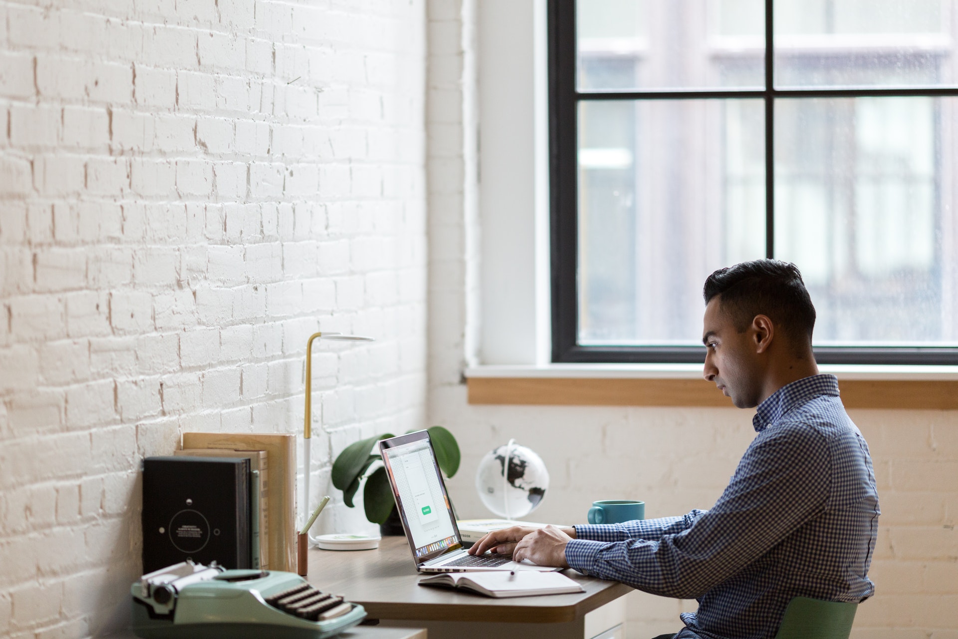 Image of a man working at a desk - is he adding value to his customers?