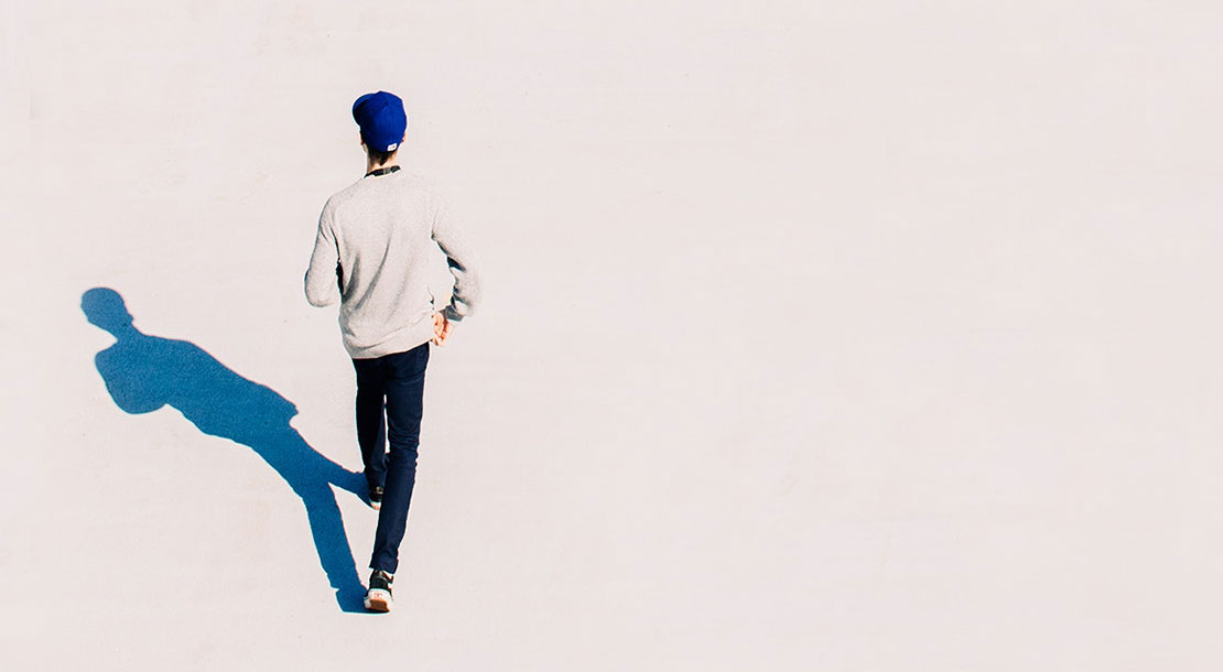 Solitary man walking to show how customers traits are different