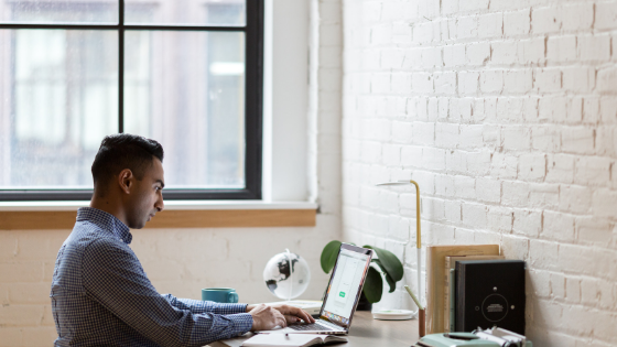 Image of a man working at a desk - culture affects employee engagement